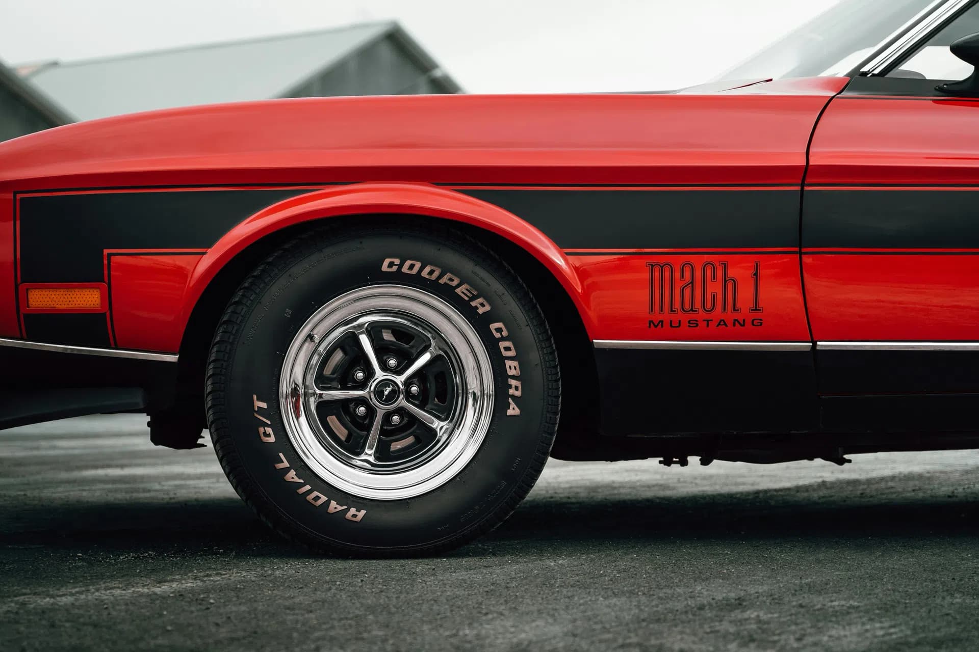 Mustang Mach 1 original vs AI watermark removal with garbled MUSTANG lettering — Original