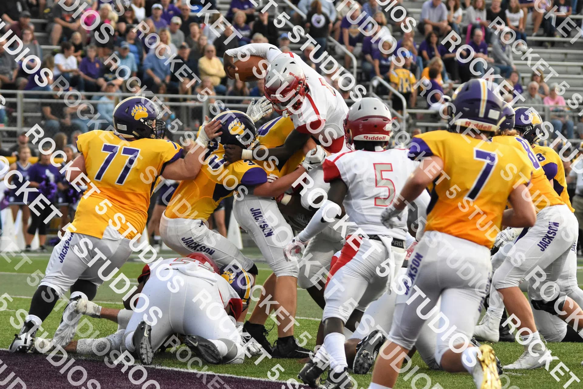 Sports photo with a tiled diagonal watermark at 60% opacity